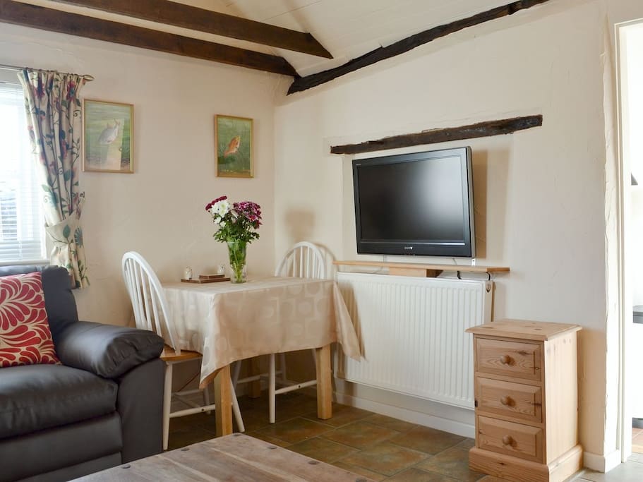 The lounge also has a small table for dining. TV with Freeview and DVD Player.
