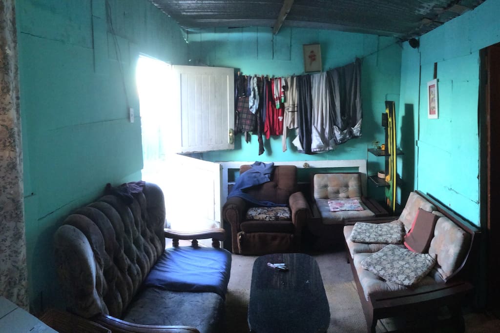 The front room contains the kitchen and lounge. This is the lounge.