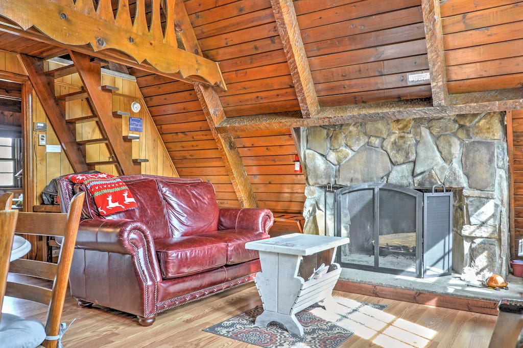 Warm your toes by the stone fireplace in the living area.