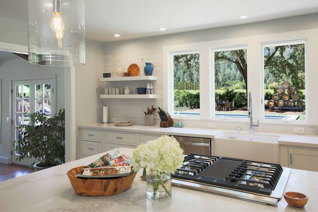Kitchen has direct access and views to pool and vineyards