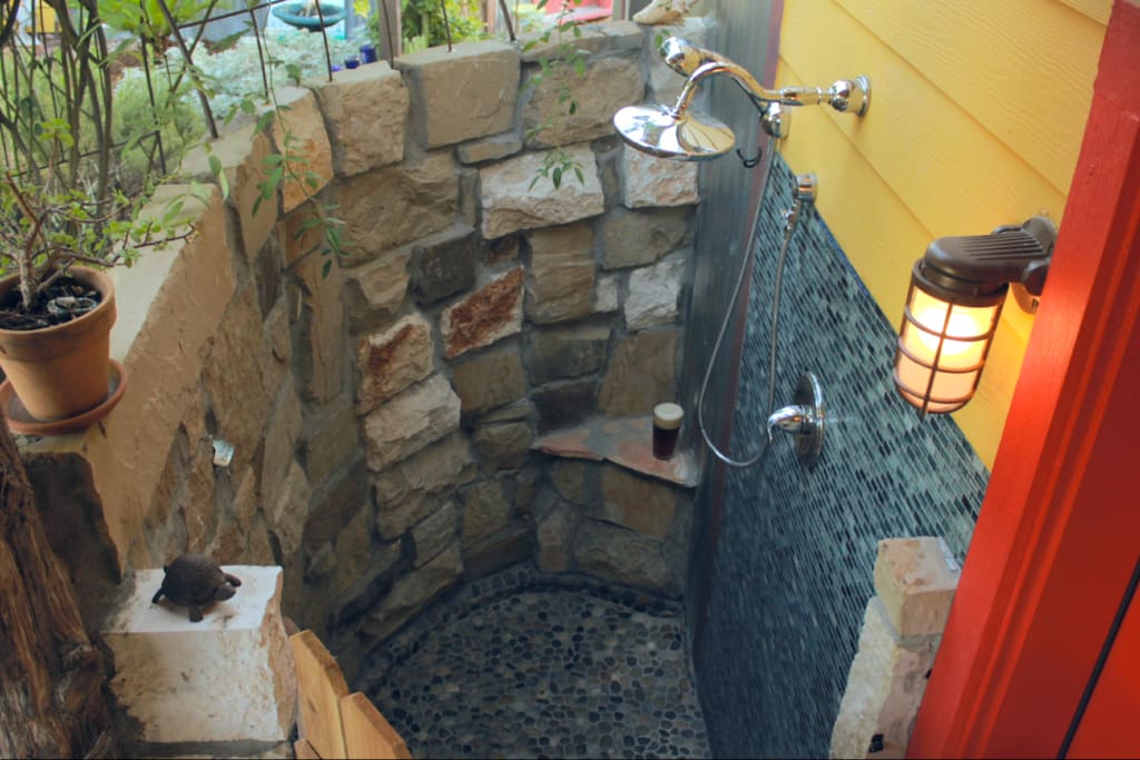Sexy outdoor shower with organic, biodegradable soap, shampoo and conditioner. Neiman Marcus fluffy robes in the closet.