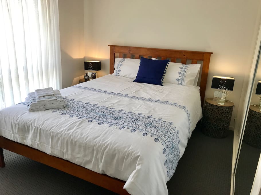 Queen bed with fitted wardrobes