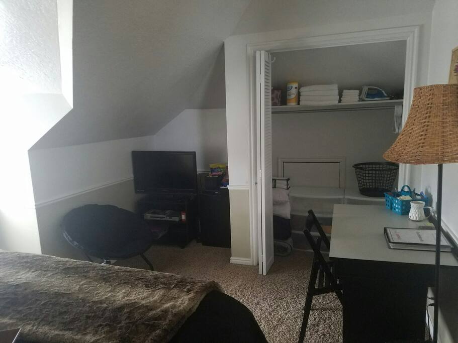 your comfy room, tv, mini fridge, closet and desk.