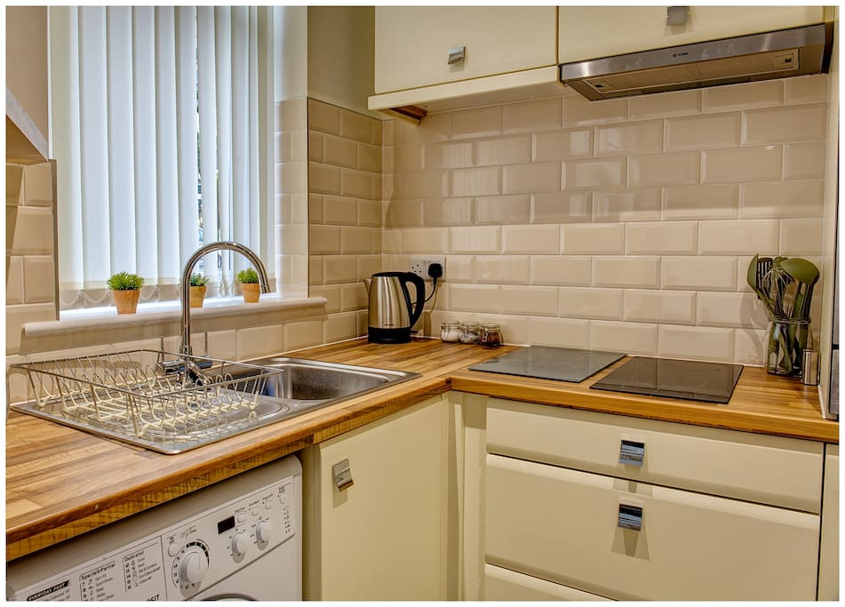 Clean and well equipped kitchen. Includes washer.