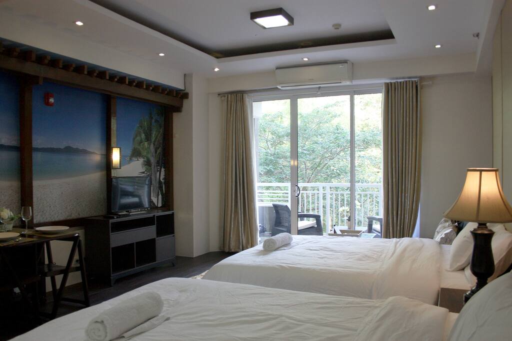 Beds are facing the sea view mural