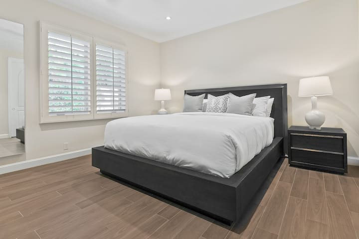 Bedroom 3 in the main house. It has a Cal King bed and it's own en suite bathroom.