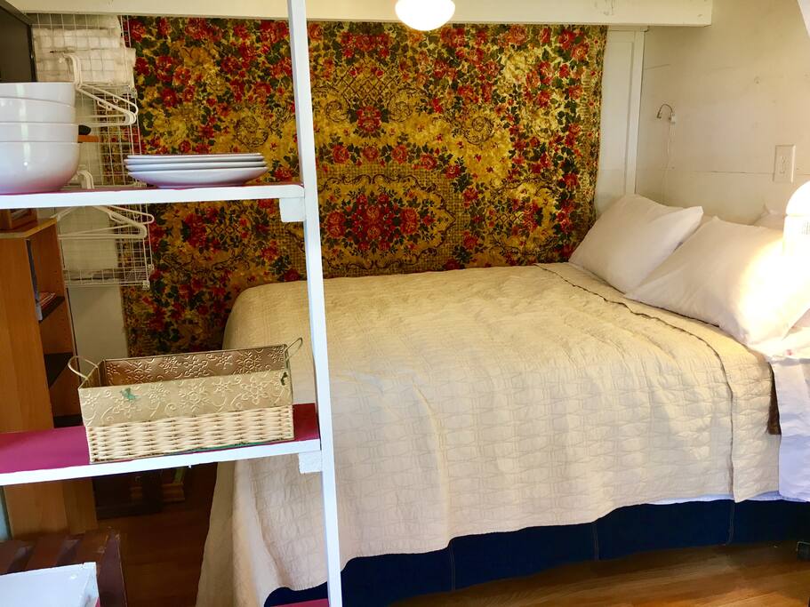 Kitchen shelving, lower Queen bed.