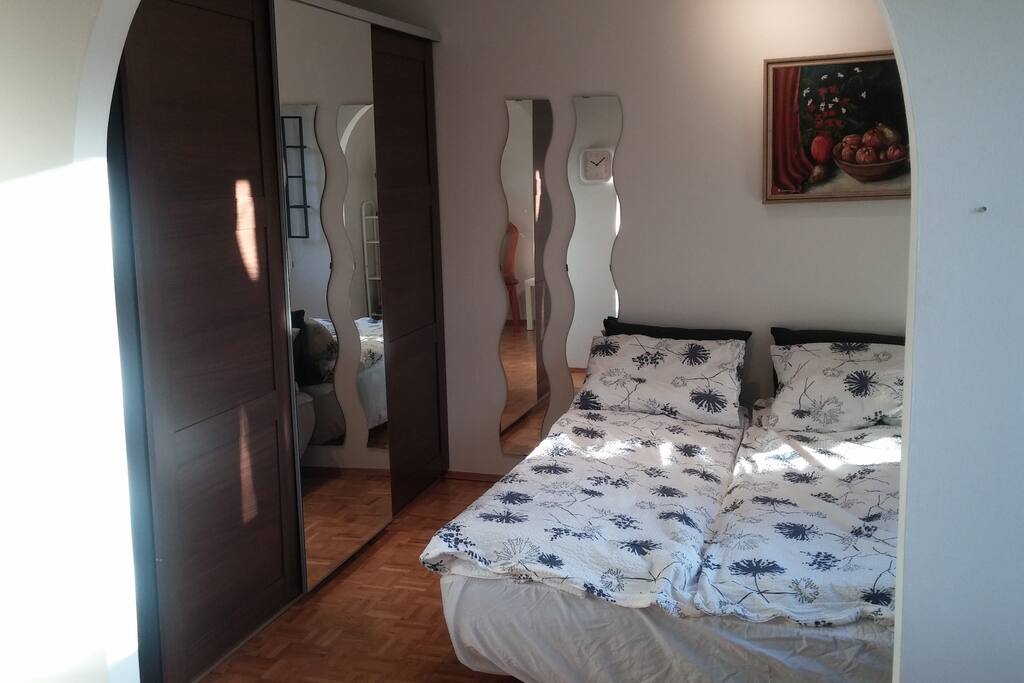 Room with double bed and one single bed.