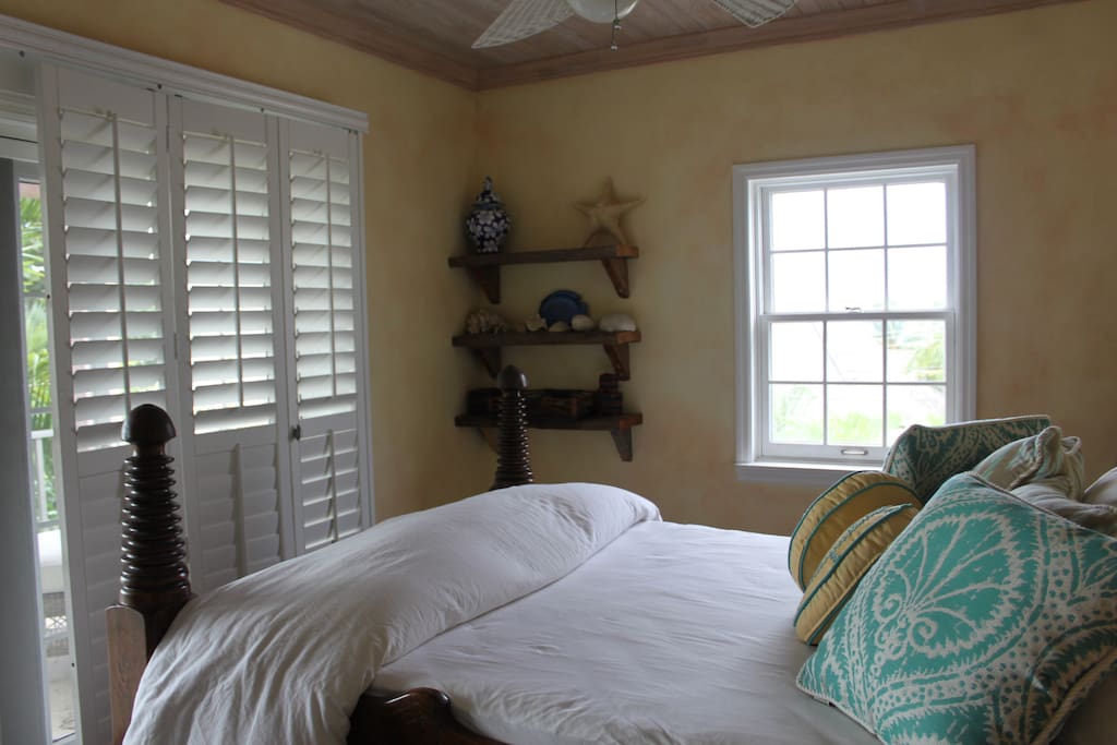 Upstairs bedroom with balcony access.