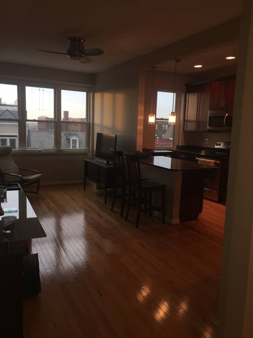 Kitchen, breakfast bar/island and living room. TV includes local channels, NetFlix, Hulu and Amazon Prime.