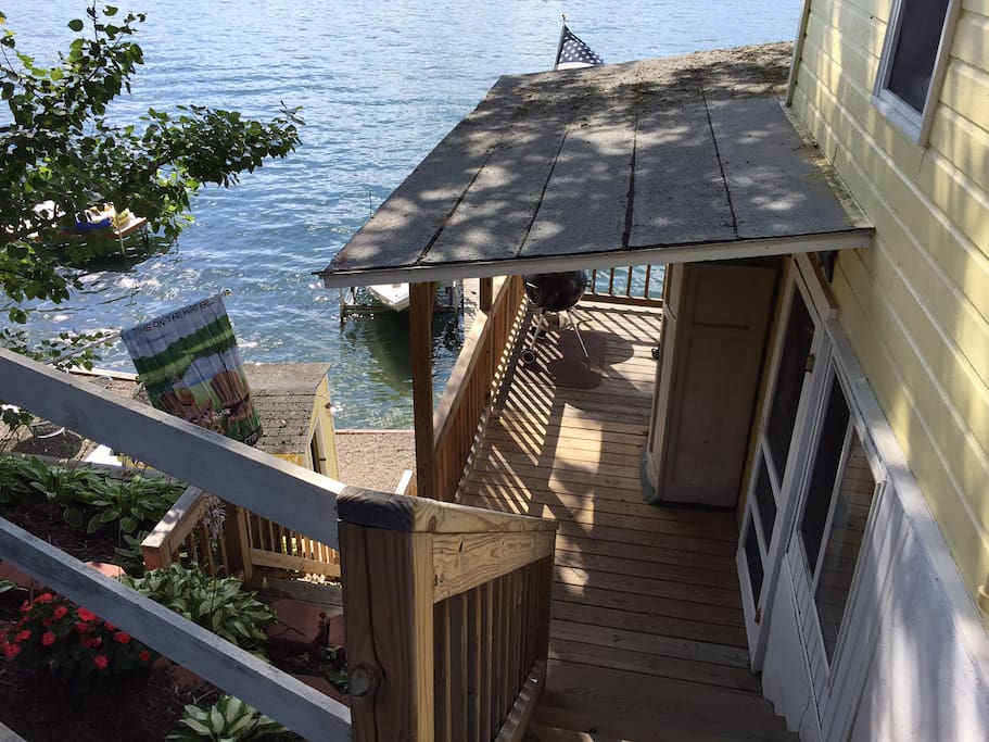 Steps down to side entrance (kitchen & living area) and deck.