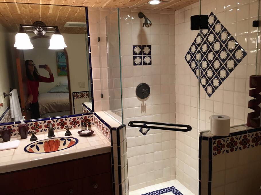Your own private bathroom has a shower and beautiful Mexican tile. There is also soap, shampoo and a blow dryer.