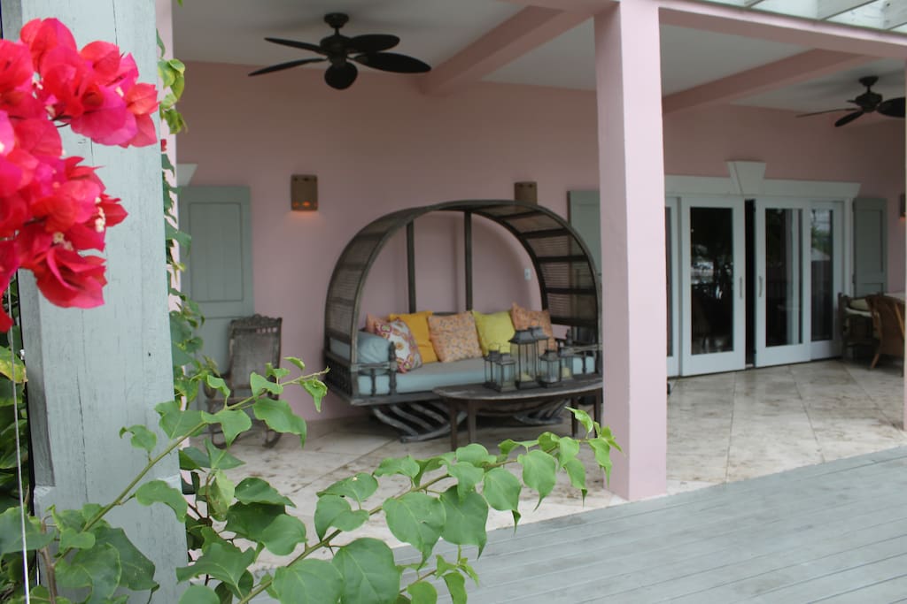 Great outdoor living space in the front and rear of the house. Choose from roomy chaise lounges to a rocking chair.