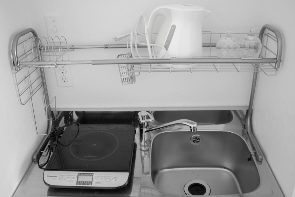 Small kitchen with IH heater, sink, T-fal, glasses, dishes, pans