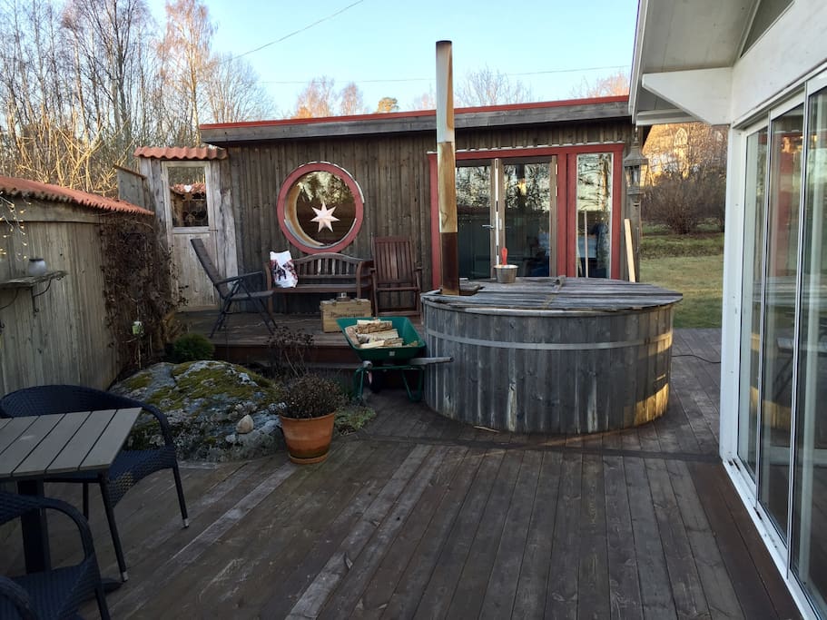 The terrace holds a wood fired hot tub and outdoor shower. The small house holds a fully equipped bathroom, sauna, and relax area with a double queen size bed