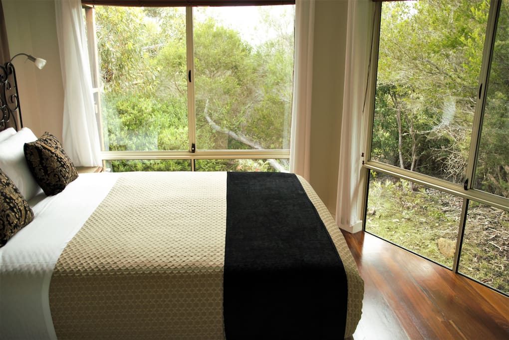 Awaken Bedroom 1 adjoins the large bathroom with a shower over 2 person spa bath which also adjoins the other bedroom.