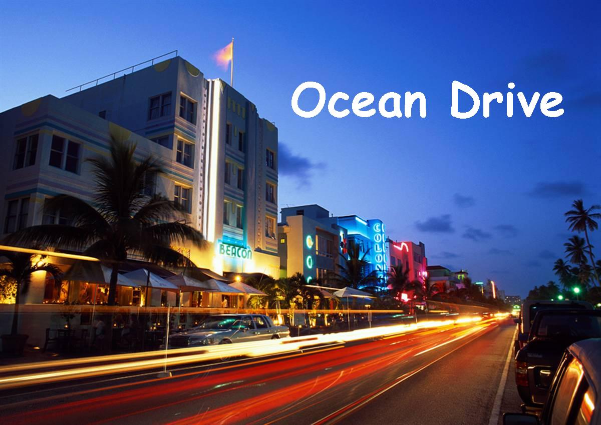 The vibrant Ocean Drive is depicted at twilight, illuminated by neon signs from various buildings. Lush palm trees line the street, adding a tropical touch. Streaks of light from passing vehicles suggest lively activity, inviting guests to explore the area.