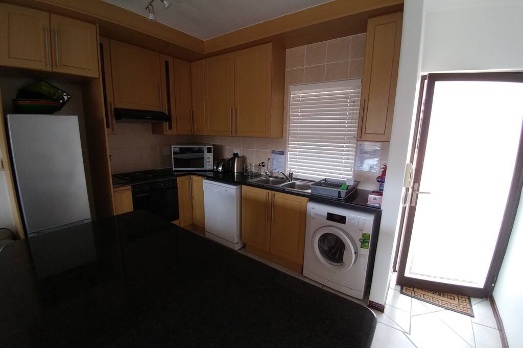 Front door and kitchen