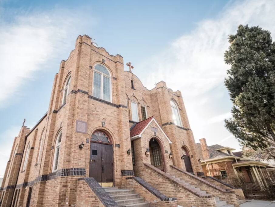 The 3BR in-law suite is on the inside of this renovated church. There are three sets of double doors (left, middle, right)—our space can be accessed by going to the double doors on the left hand side.