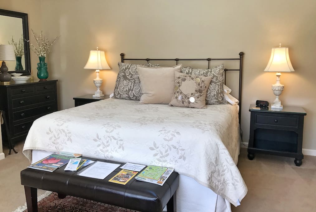 Romantic bedroom with quality bedding by Garnet Hill and Pottery Barn. Lots of alternative down pillows for sleeping. And yes, we provide you with maps and brochures of the area!