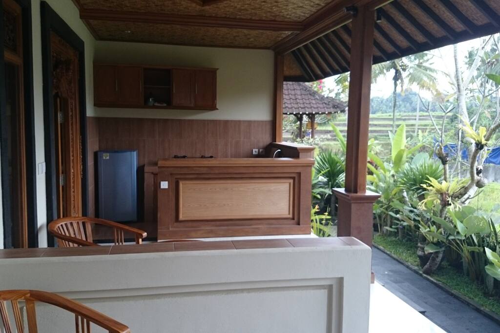 Spacious open air terrace kitchen and eating area by the rice fields.