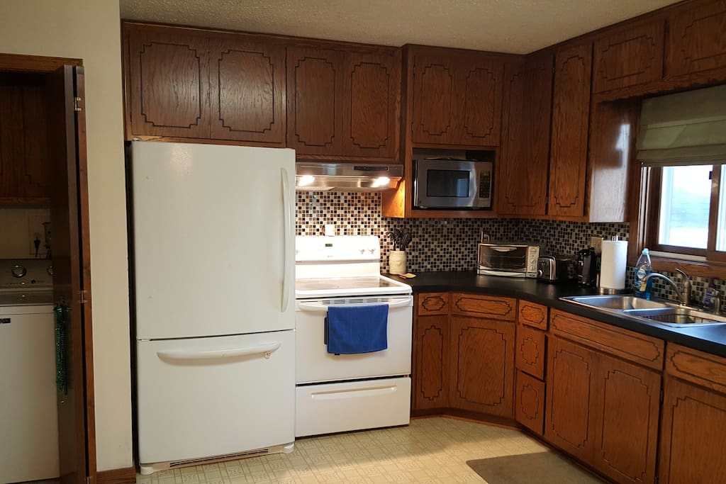Partial View of Kitchen, Nearby Washing Machine and Dryer,