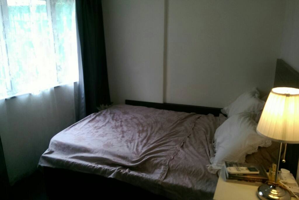 Bright bedroom with light-proof curtains.