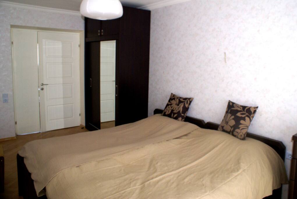 Bedroom with two-repeatable beds, Drawers, Closet and Balcony with view of Mtatsminda Mountain and Mtkvari River