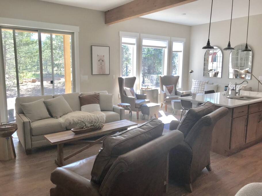 Main Level- Sliding glass door and large windows warmly invite the outdoors inside.