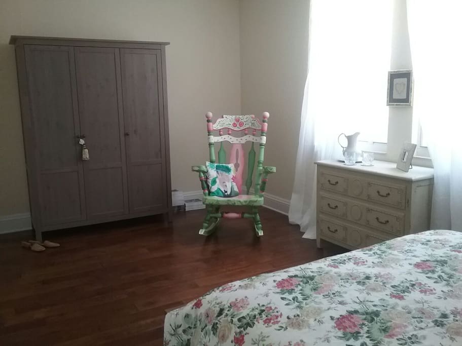 The Master Suite from another angle. Note the ample closet and decorated rocking chair.