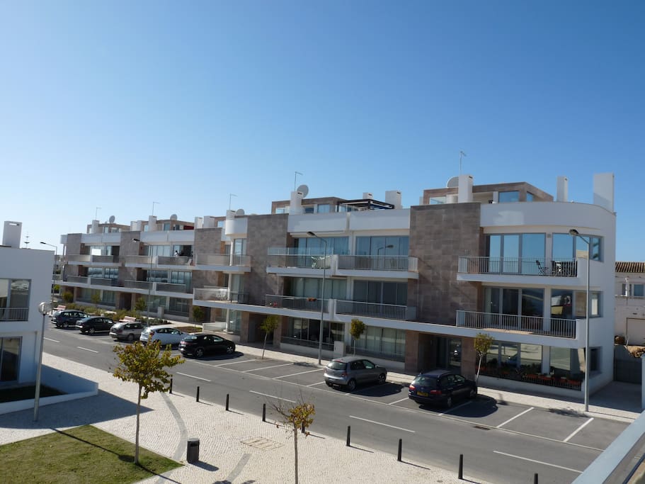 front of apartment blocks with parking outside