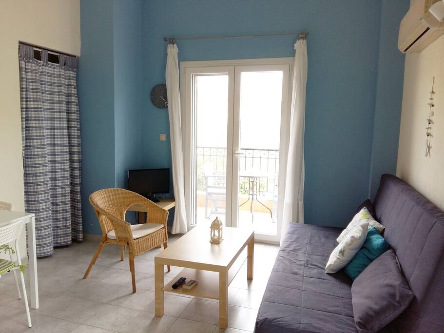 Spacious living room with couch that turns into a double bed