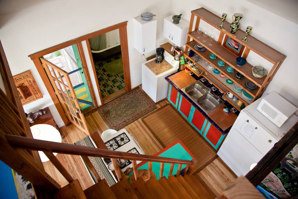 stairway from loft where there is a queen mattress
