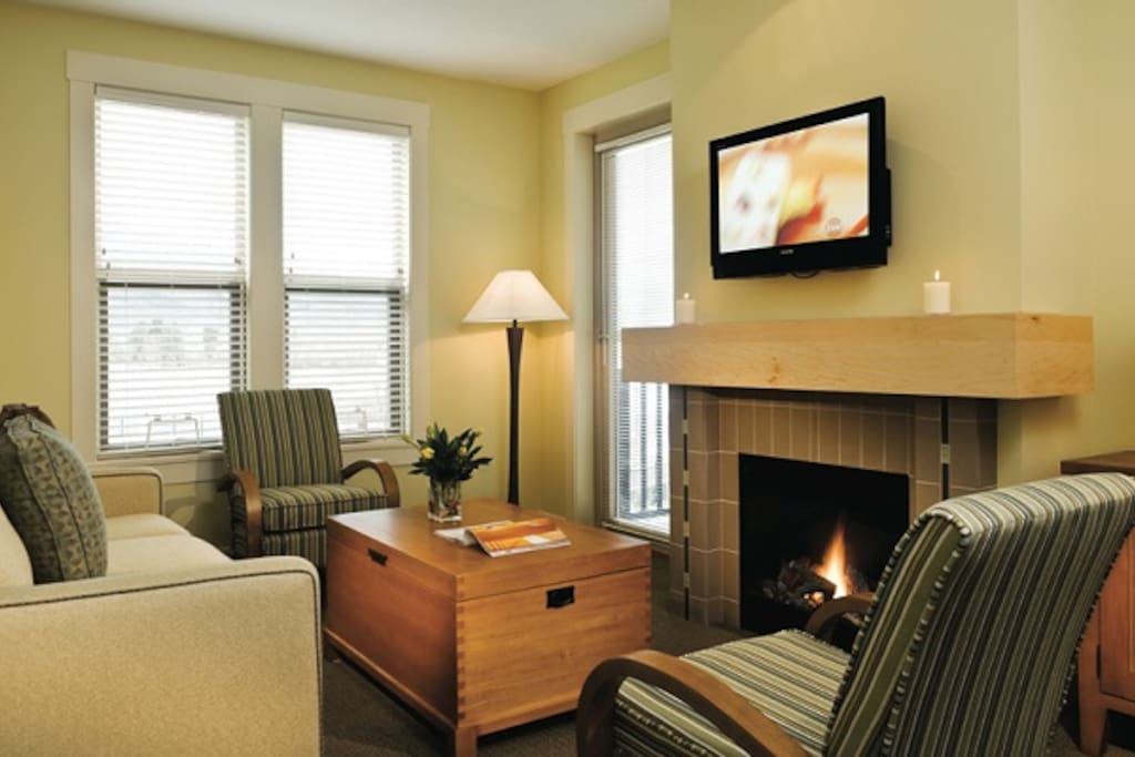Neutral hues and large windows make this condo bright and inviting.