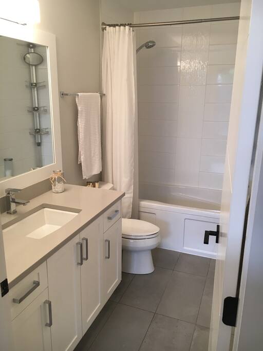 Bathroom has a non slip mat available for safety. it also has a vertical washer and dryer.