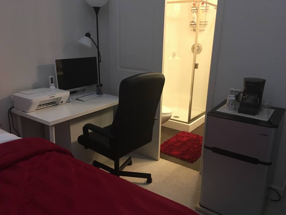 Room with attached bathroom, mini fridge, coffee maker and study. Everything you need for comfortable stay!