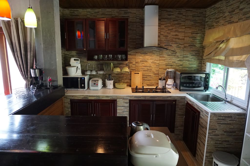 Kitchen. There is a coffee machine, blender, juicer, electronic cooker, oven, microwave. We have even a popcorn machine. For comfortable cooking on gas, we have extractor hood.