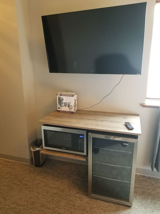 50 inch smart TV , microwave and mini fridge for your use.