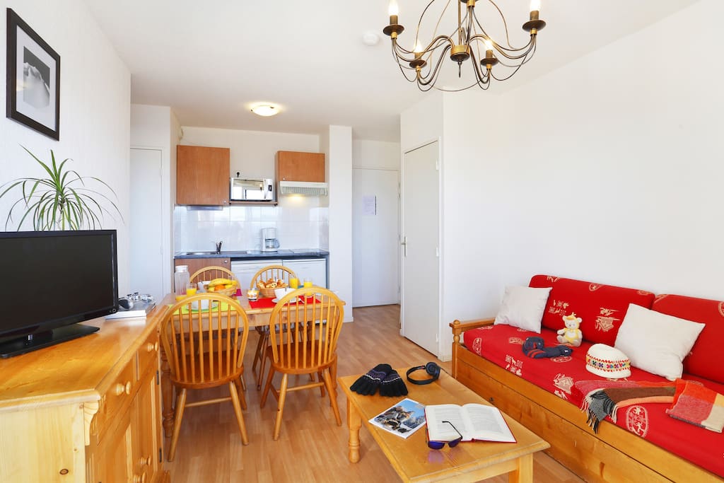 Prepare meals in the kitchenette and enjoy them at the dining table.