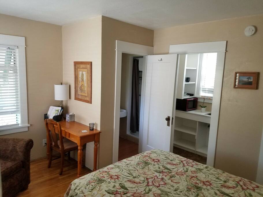 Easy chair, desk and chair, bath, and kitchenette