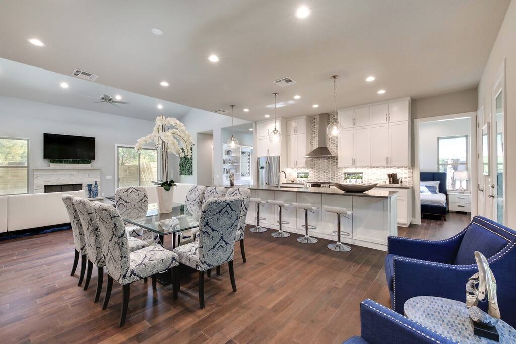 Modern dining area and bar seating provides room for the entire group to enjoy a drink or a meal together