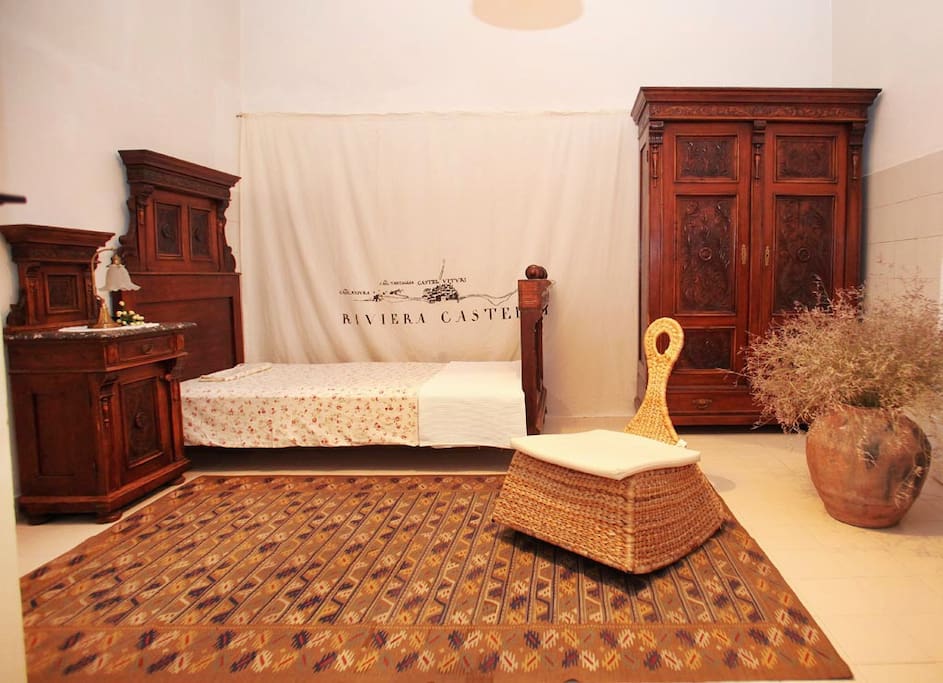 Charming double bedroom with antique furniture