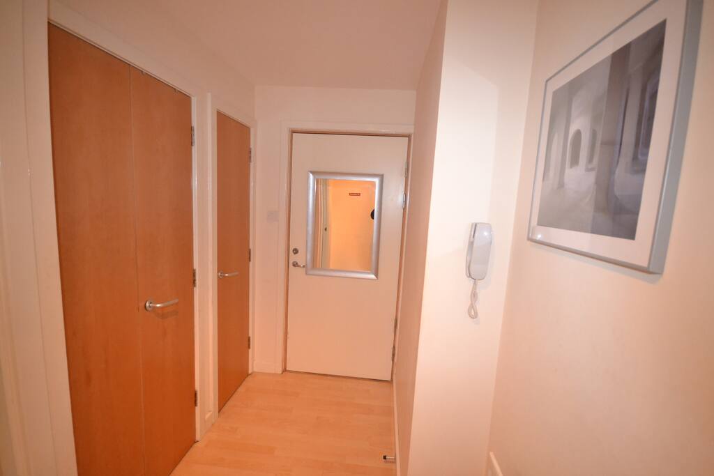 Entrance and corridor with two good sized cupboard