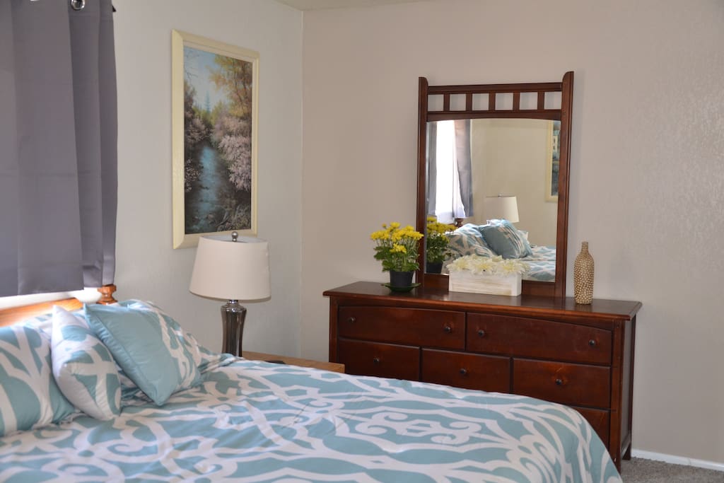 The bedroom has a queen bed and walk-in closet.