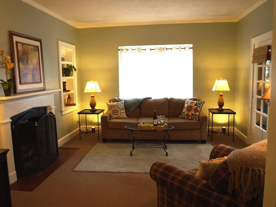 Living room with fireplace, TV and comfortable seating