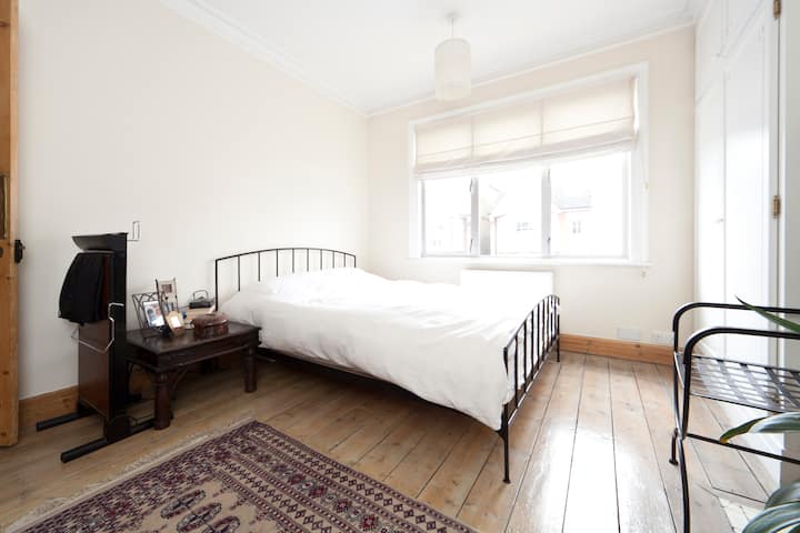 Upstairs master bedroom. King size (160cm*200 or about 63 in by 79 in). Window overlooks the cul-de-sac street