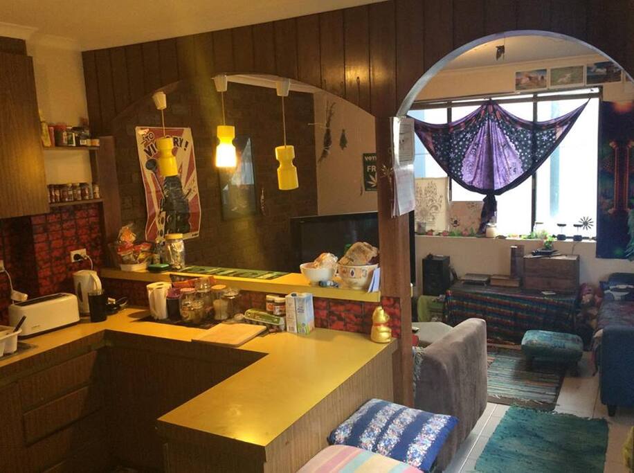 Funky red brick yellow counter top kitchen