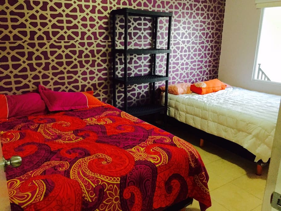 Dormitorio con dos Queen size