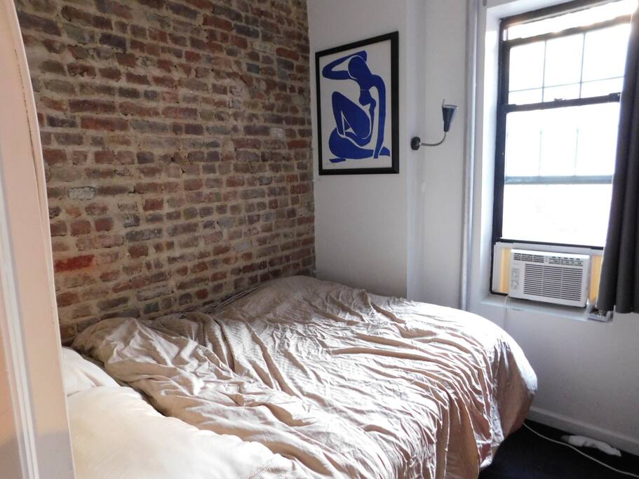 Bedroom with exposed brick wall!