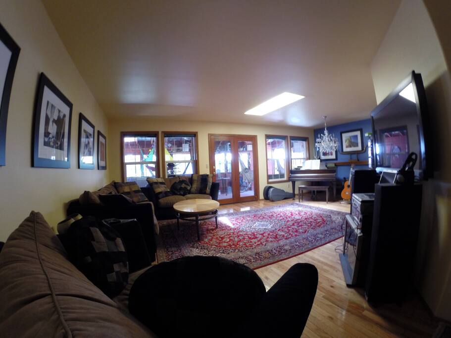 Shared living room with grand piano